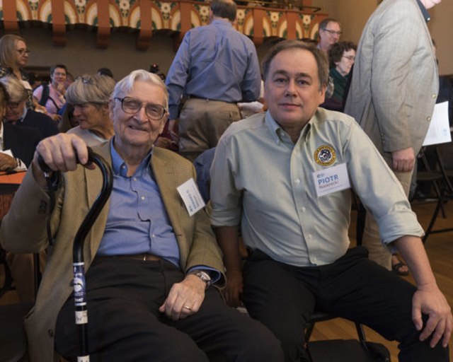 E.O. Wilson and Piotr Naskrecki at a conference.  