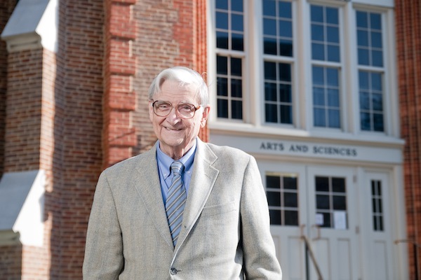 Image of E. O. Wilson standing in front of the University of Alabama. 