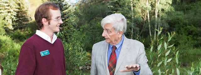 Image of E.O. Wilson and another man standing outside.