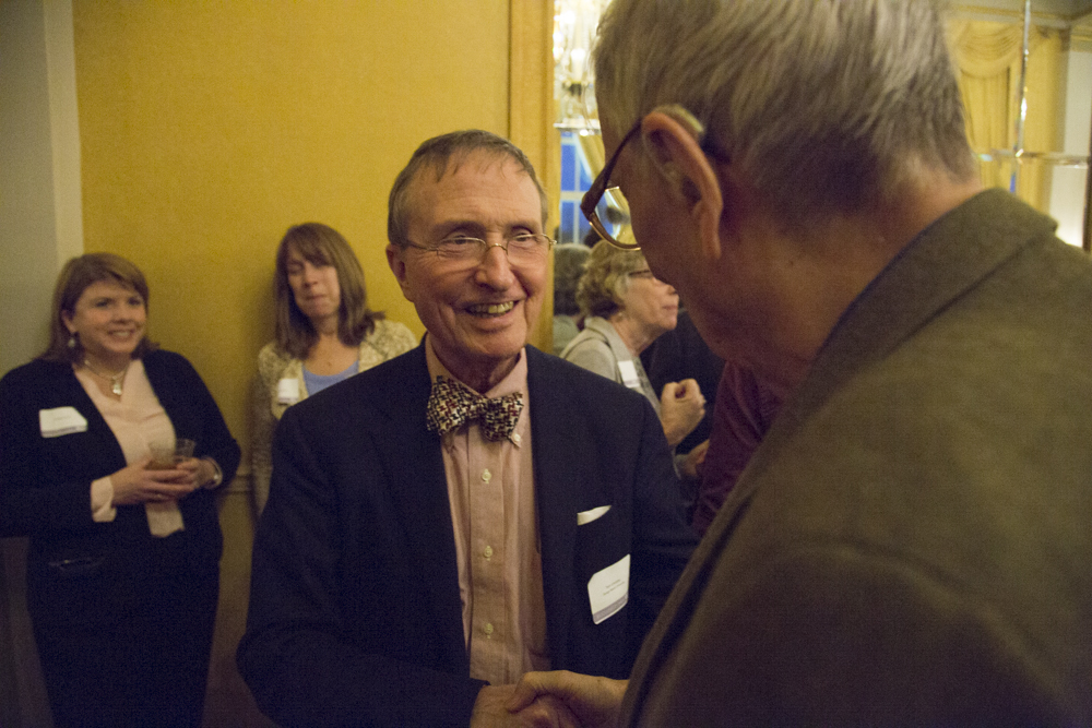 Thomas Lovejoy shaking hands with E.O. Wilson.