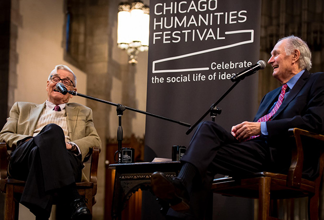 Image of E.O. Wilson and another man speaking on stage at the Chicago Humanities Festival.