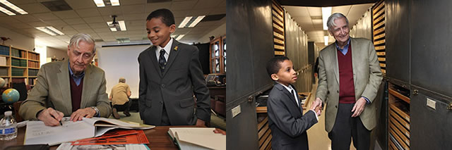 Jasper Bagley, 11, shakes hands with his idol, E.O. Wilson, among shelves of animal specimens in Berkeley’s Museum of Vertebrate Zoology.