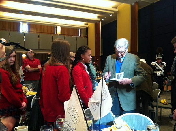 Wilson signs books for students from St. Ann Academy (Bridgeport, Connecticut) at the Celebration! Benjamin Franklin, Founder luncheon reception.