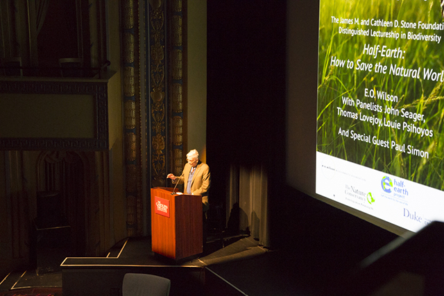 Image of E.O. Wilson giving a speech on stage.