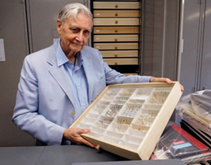 E.O. Wilson displaying his collection of ant specimens.