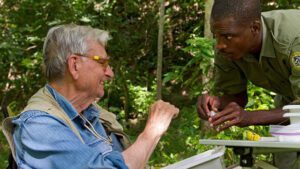 Image of E.O. Wilson and another man doing field work in Gorongosa National Park, Mozambique.