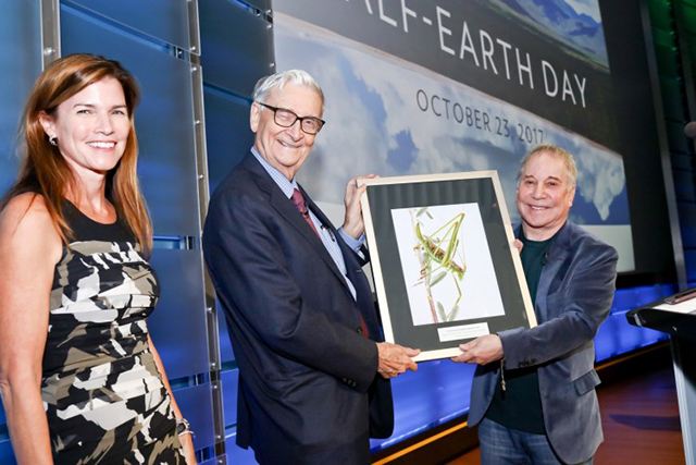 E.O. Wilson Biodiversity Foundation president and CEO Paula Ehrlich (left) stands with eminent biologist Edward O. Wilson (center) and legendary recording artist Paul Simon (right) at the evening session of the planet’s first-ever Half-Earth Day. The inaugural event was co-convened by National Geographic and the E. O. Wilson Biodiversity Foundation and held at the National Geographic Society in Washington, D.C. on Oct. 23, 2017. Photo by Tony Powell/National Geographic.