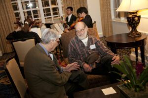 Image of E.O. Wilson and a man speaking.