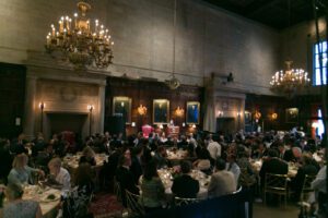 Image of the dining area full of people eating. 