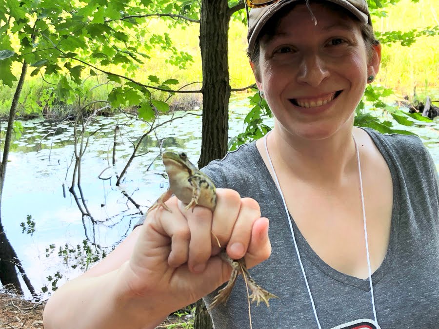 Woman holding a frog