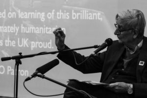 Black and white image of E.O. Wilson speaking.