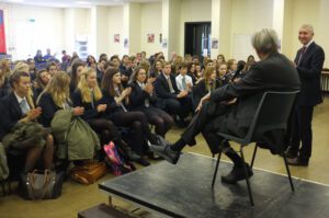 Image of E.O. Wilson speaking to a crowded room.