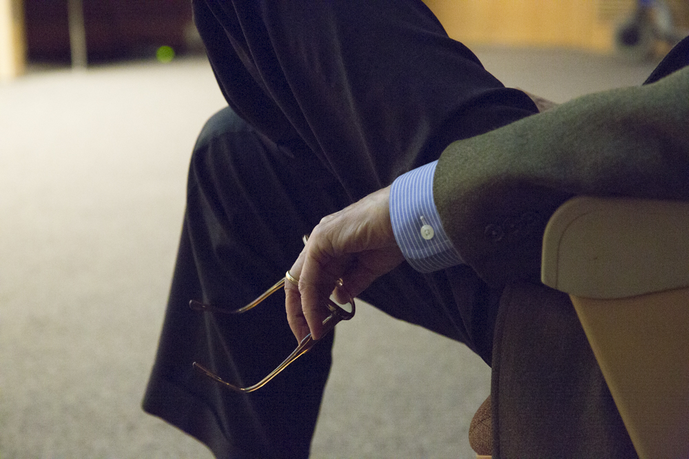 Image of E.O. Wilson holding his glasses. 