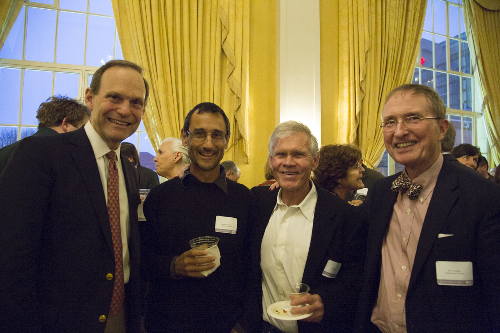 Image of four people standing together.