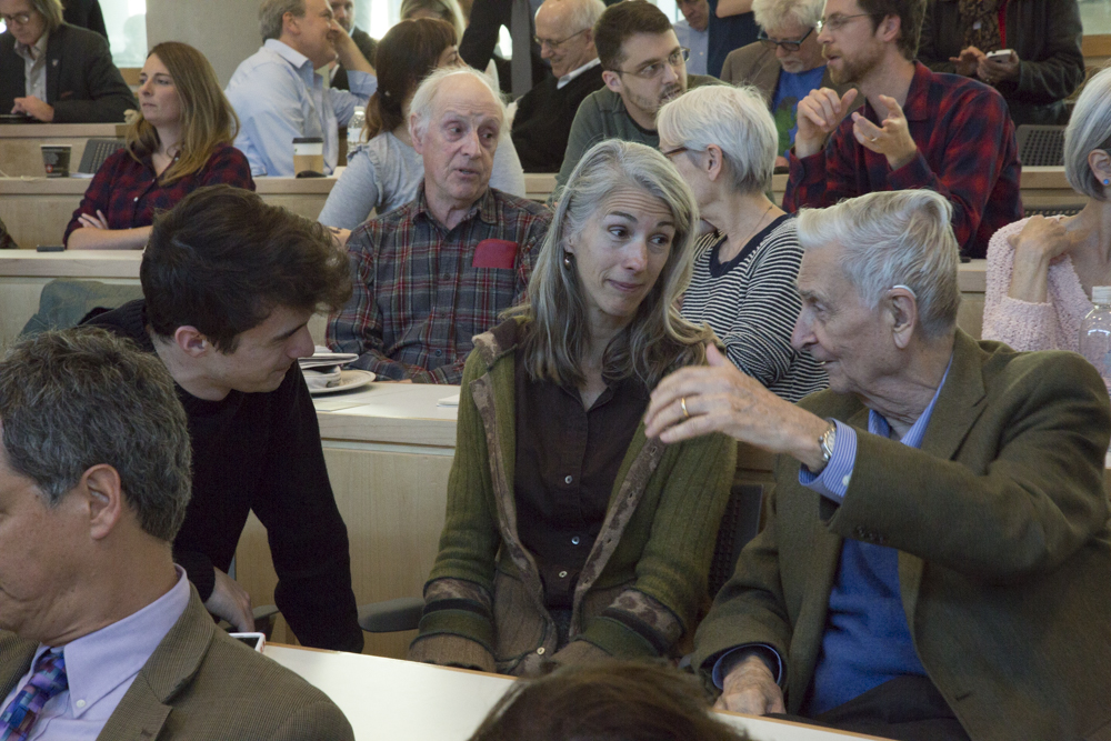 Image of E.O. Wilson speaking with a few people. 