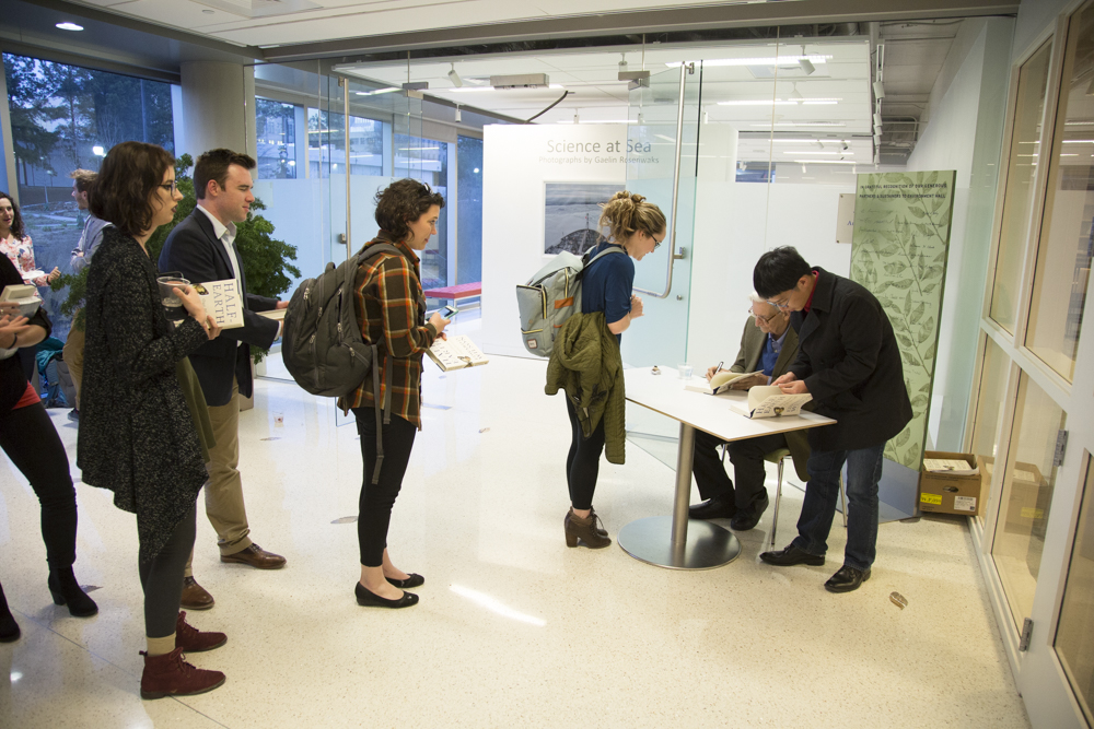 Image of people lined up to get a signed book from E.O. Wilson.